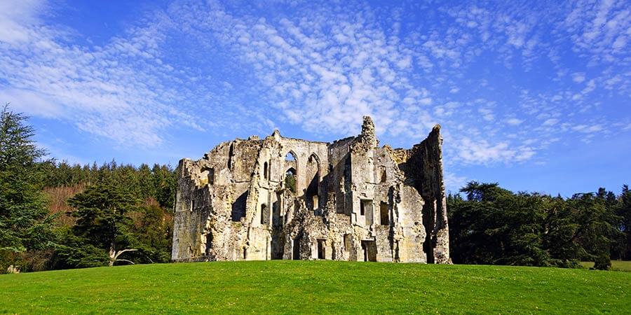 The ruins of Old Wardour Castle, Tisbury, under a blue sky